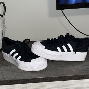 Woman’s platform adidas - size 6.5 - black & white. Used, good condition.